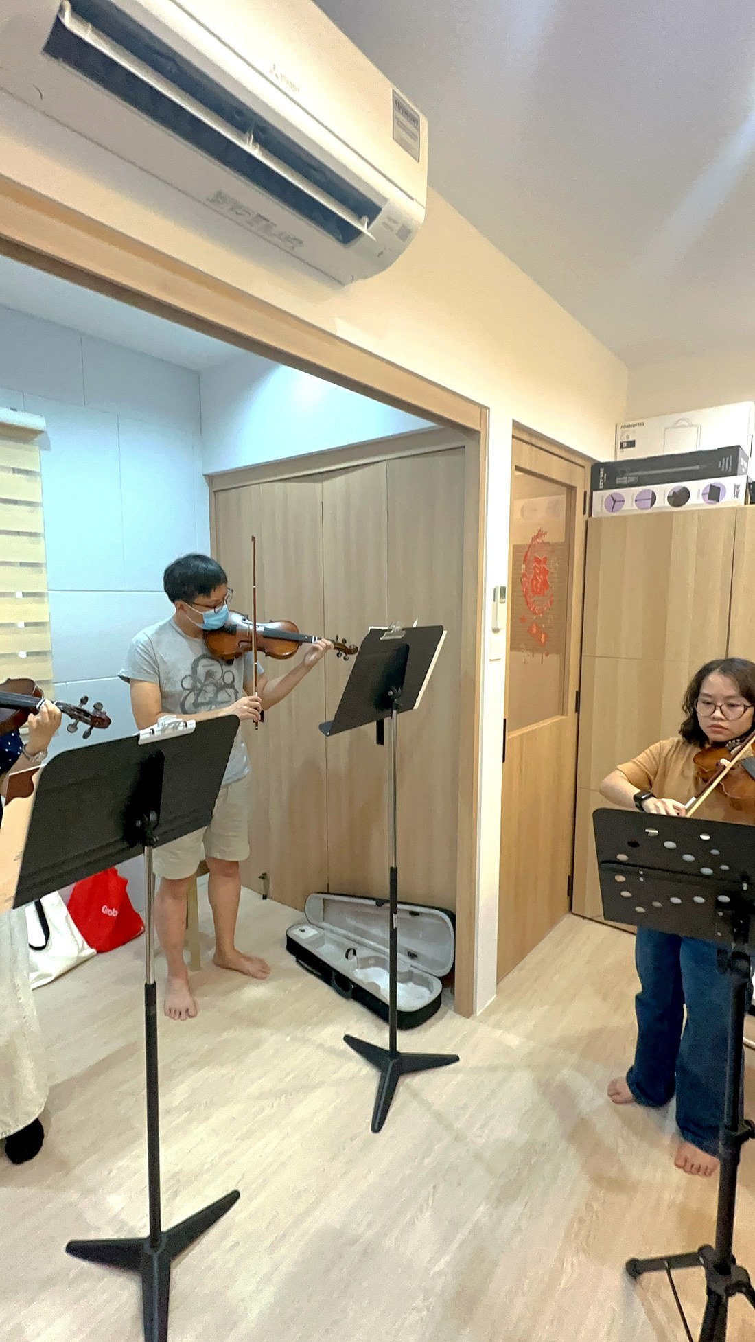 A violin group class in session at the studio